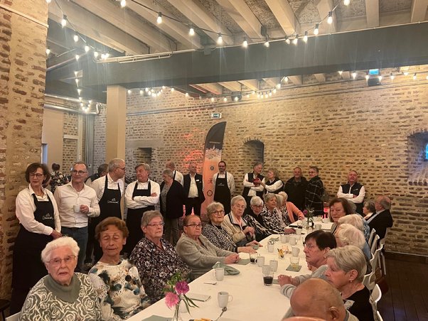 A group of people sitting at a table
AI-generated content may be incorrect.