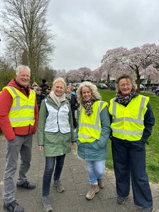 A group of people wearing reflective vests

Description automatically generated