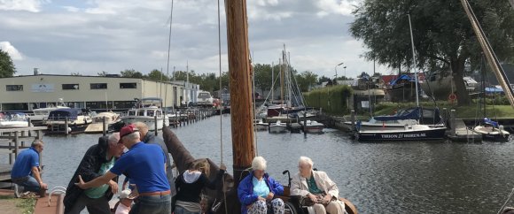 Met rolstoel op het voordek