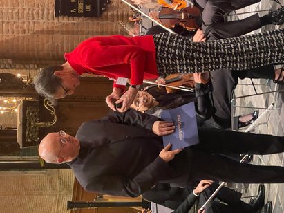 A person holding a blue paper

AI-generated content may be incorrect.