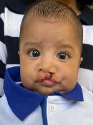 Afbeelding met persoon, Menselijk gezicht, jongen, kind

Door AI gegenereerde inhoud is mogelijk onjuist.